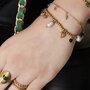 Armband staal bedel fuchsia